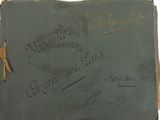 an old book with writing on it with a cross on the cover