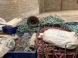 a pile of rope and other items in a room