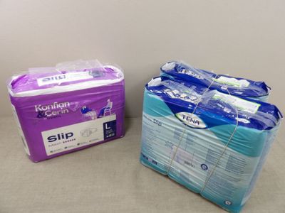 two packs of sanitary paper sitting next to each other on a table