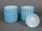 pair of blue and white glass vases with lids on a gray surface