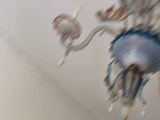 a chandelier hanging from the ceiling in a room