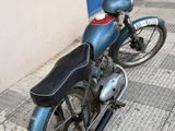 a motorcycle that is parked on the side of the street
