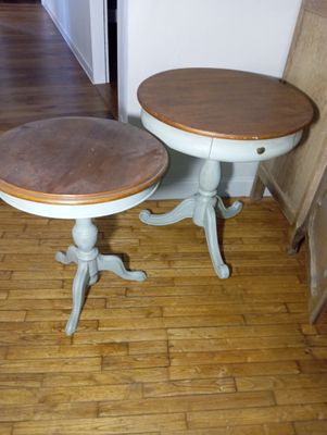 two tables that are sitting on a hard wood floor