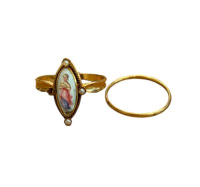 an image of a gold ring with a picture of jesus on it