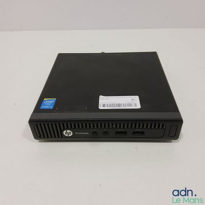 the hp desktop computer is sitting on a white surface