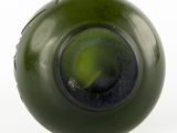an image of a green glass bottle with a hole in it