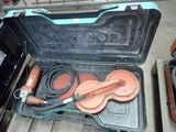an open suitcase with a hose and a hose in it