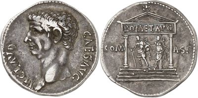 a silver coin with an image of a man and a woman on it