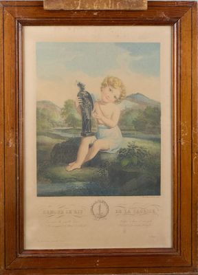 an old picture of a baby sitting on a rock with a bird in its hand