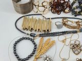 many different types of jewelry on the table