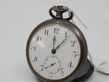 a pocket watch that is sitting on top of a table