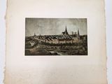 an old photo of a city with a river in the foreground