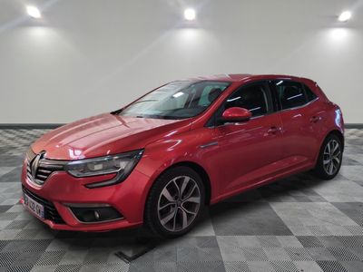 a red car parked in a garage with a checkered floor