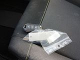 a picture of a car seat with a remote control in it