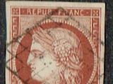 a close up of a stamp with a picture of a woman on it