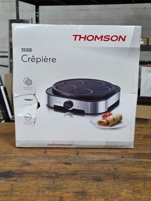 un gros plan sur la boîte d'une machine à crêpes posée sur une table