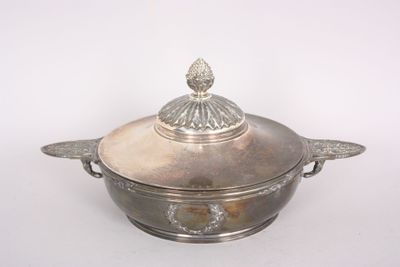 a silver pot with a lid on a white surface