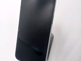 a cell phone that is sitting on top of a stand