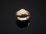 an 18k yellow gold ring set with a round brilliant cut diamond