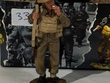 figurine of a soldier with a gun in front of a box