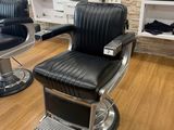 a barber chair in the middle of the room