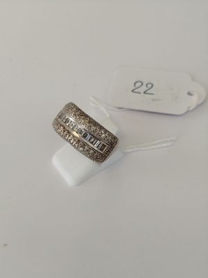 a close up of a ring on a white surface with a price tag