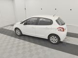 a picture of a small white car parked in a garage