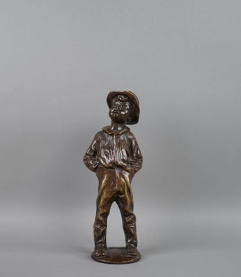 bronze figurine of a boy with a hat on his head