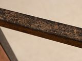 a close up of a piece of metal on a table