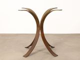 a pair of brass and glass side tables with curved legs