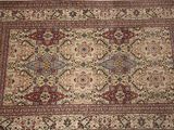 an oriental rug on a wooden floor in a room