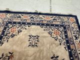 a rug on the floor with a cat laying on it
