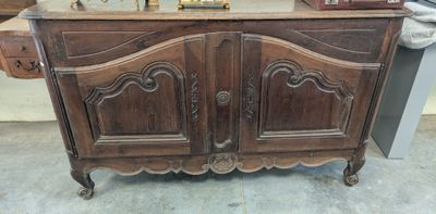 a wooden cabinet that has a clock on top of it