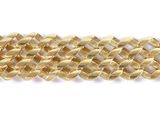 a close up of a gold chain bracelet on a white background