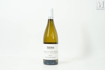a bottle of wine that is sitting on a table