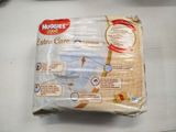 a bag of baby diapers sitting on a table