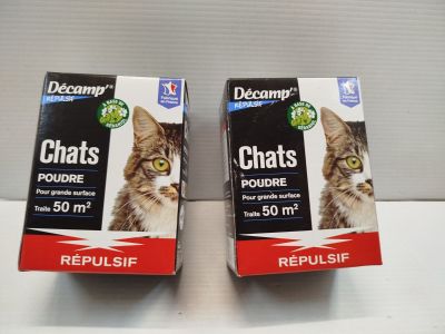 two boxes of cat litter sitting on top of a white counter