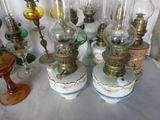 a lot of glass lamps that are sitting on a table