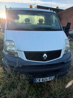 a white van that is parked in the grass