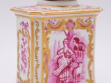 an image of a pink and gold box with a picture of a woman