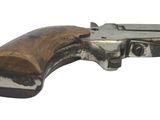an old gun with a wooden handle on a white background