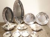 a lot of silver plates on the table