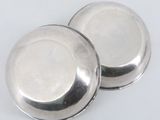 pair of silver plated salt and pepper shakers on a white background