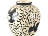 un vase noir et blanc orné d'un motif d'oiseau