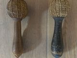 two wooden balls on the floor next to each other
