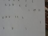 a piece of paper with numbers on it sitting on a table