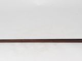 an old cane with a wooden handle on a white background