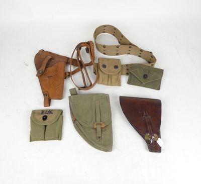 several different types of leather and canvas items on a white surface