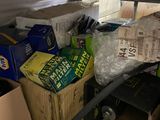 a pile of boxes and other items in the back of a truck
