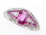 a close up of a pink diamond and white gold ring